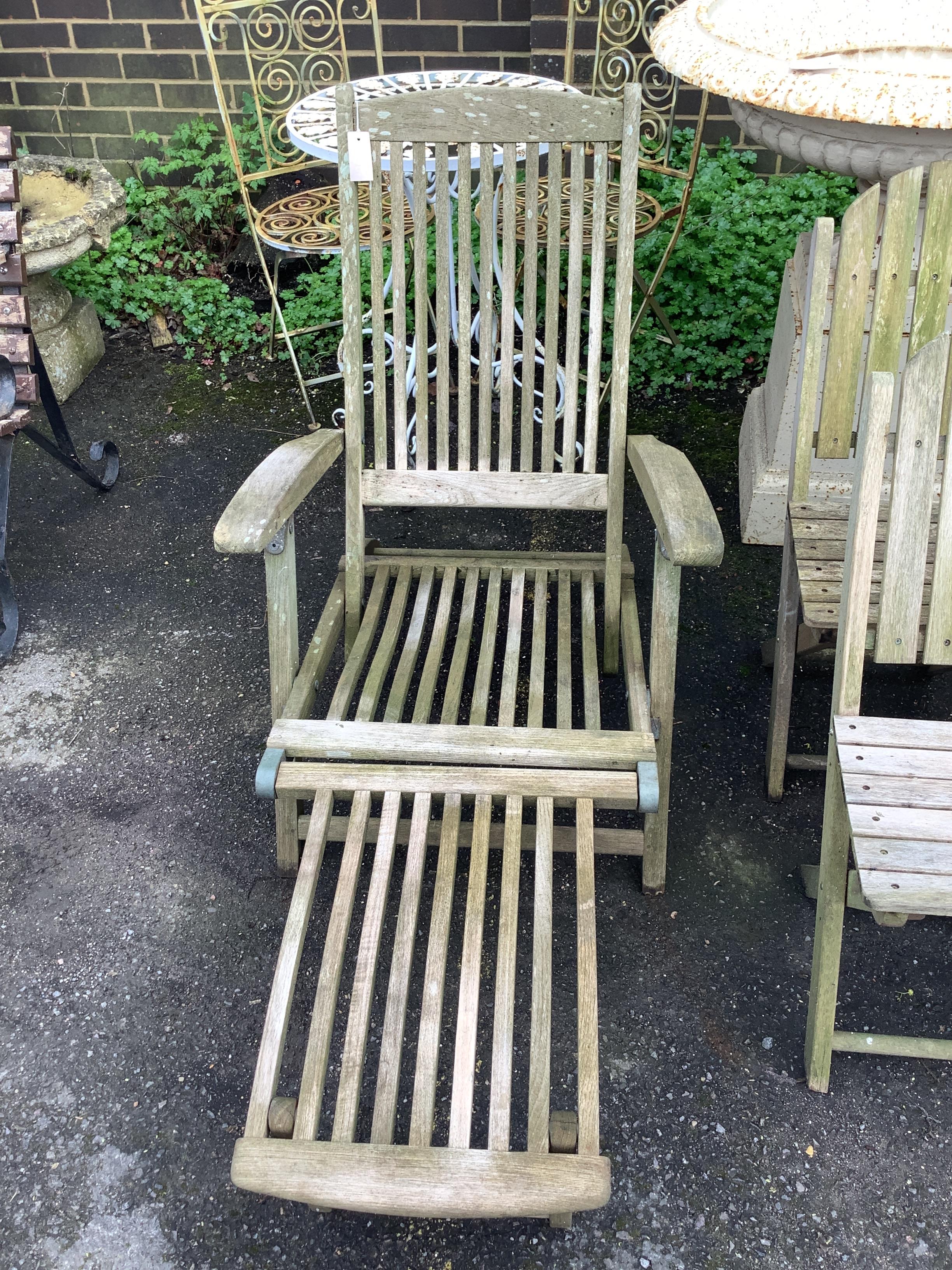 A set of four Alexander Rose teak folding garden elbow chairs, an Alexander Rose teak steamer chair and four other teak folding garden chairs